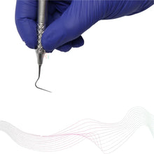 Dental tool held by a gloved hand on a white background
