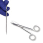 Surgical scissors and needle held by a gloved hand on a white background